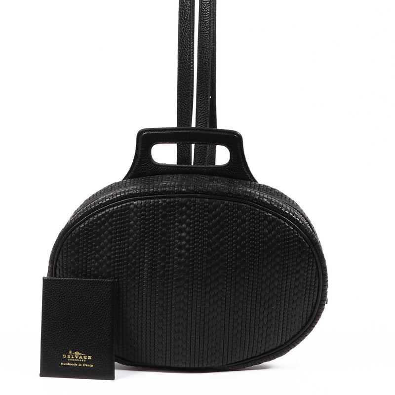 Buy an authentic second hand Delvaux Black Oval Toile De Cuir Backpack in very good condition at Labellov.com