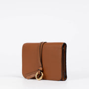 Authentic pre-loved Chloé Camel Leather Alphabet Compact Wallet on Labellov.com