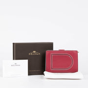 Authentic pre-loved Delvaux Framboise Taurillon Soft Daily D Wallet on Labellov.com