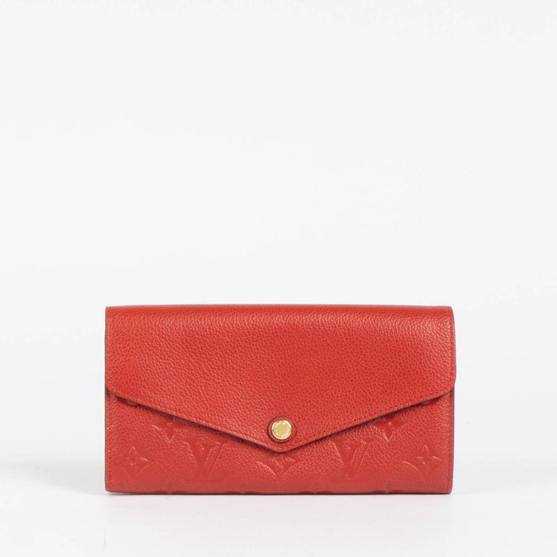 Authentic pre-loved Louis Vuitton Red Monogram Empreinte Leather Sarah Wallet on Labellov.com