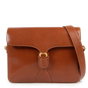 Tweedehands authentieke Gucci schouder tas in bruin leder online kopen.