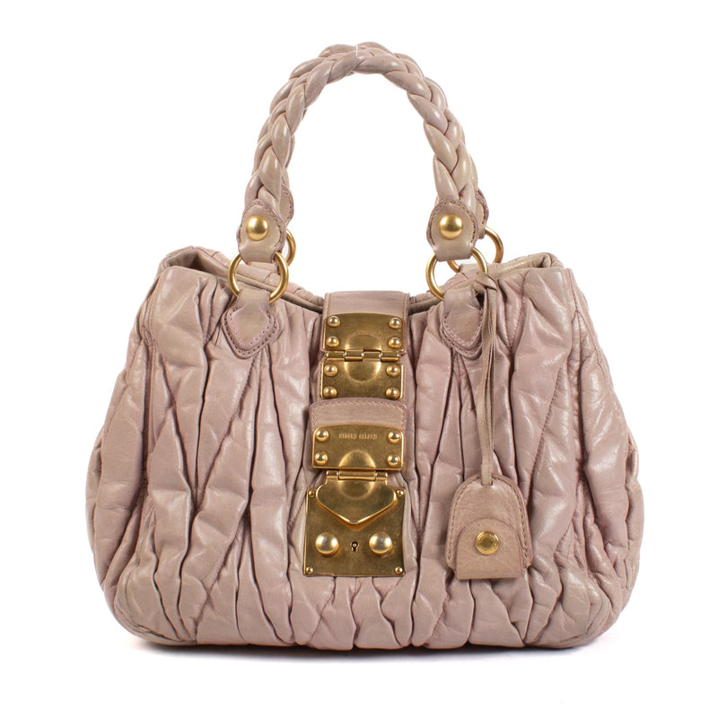 Shop safe online at Labellov in Antwerp, Brussels and Knokke this 100% authentic second hand designer Miu Miu Dusty Pink Matelasse Top Handle Bag