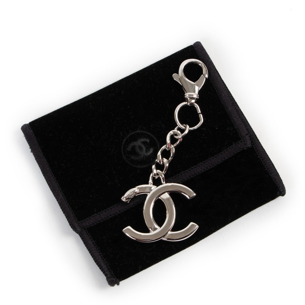 Shop authentic second hand luxury high-end designer vintage Chanel Silver CC Logo Keychain Bag Charm at Labellov.