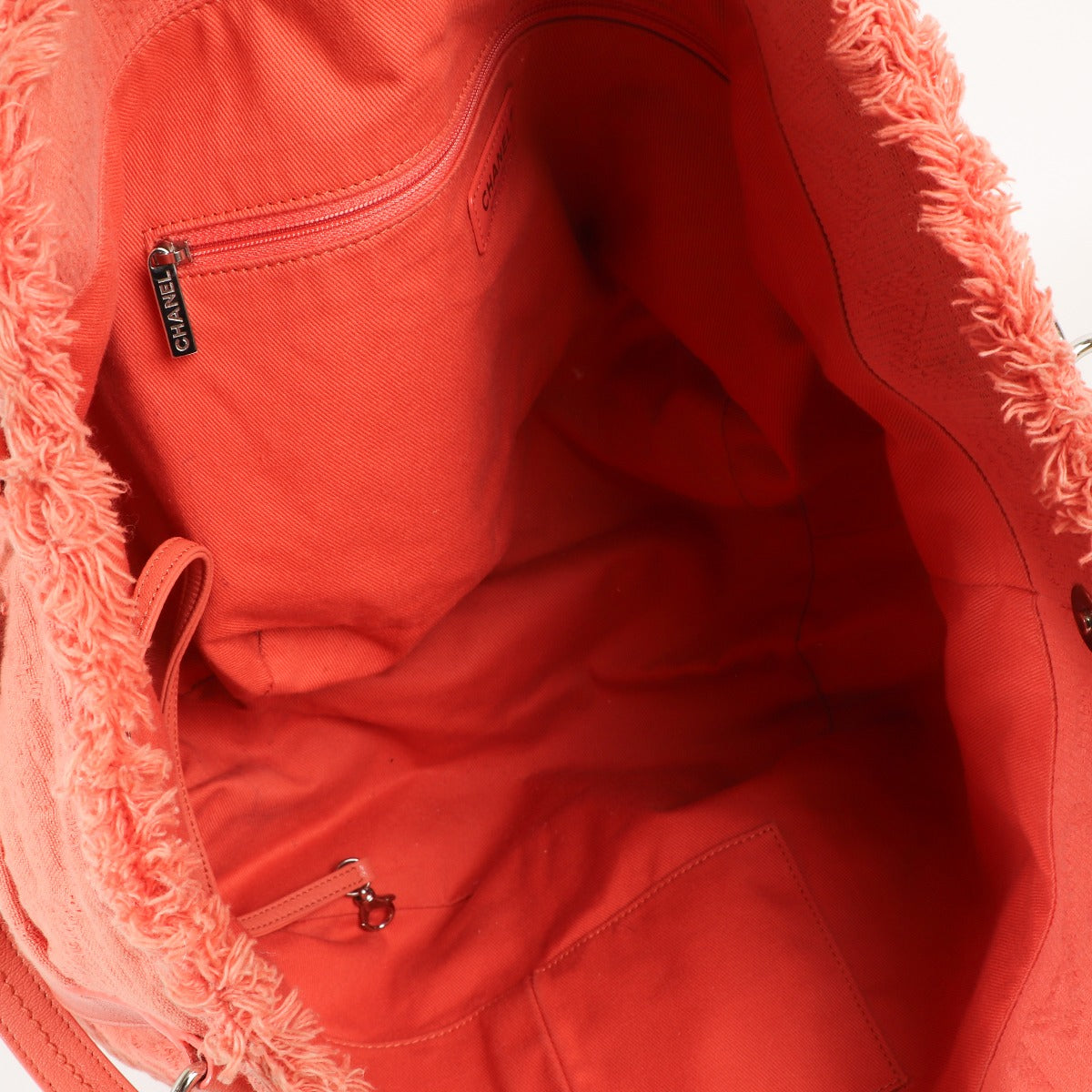 Buy an authentic second-hand Chanel Orange Fabric Tote Bag in very good condition at Labellov in Antwerp.
