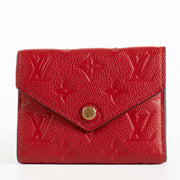 Authentic pre-loved Louis Vuitton Red Monogram Empreinte Victorine Wallet on Labellov.com