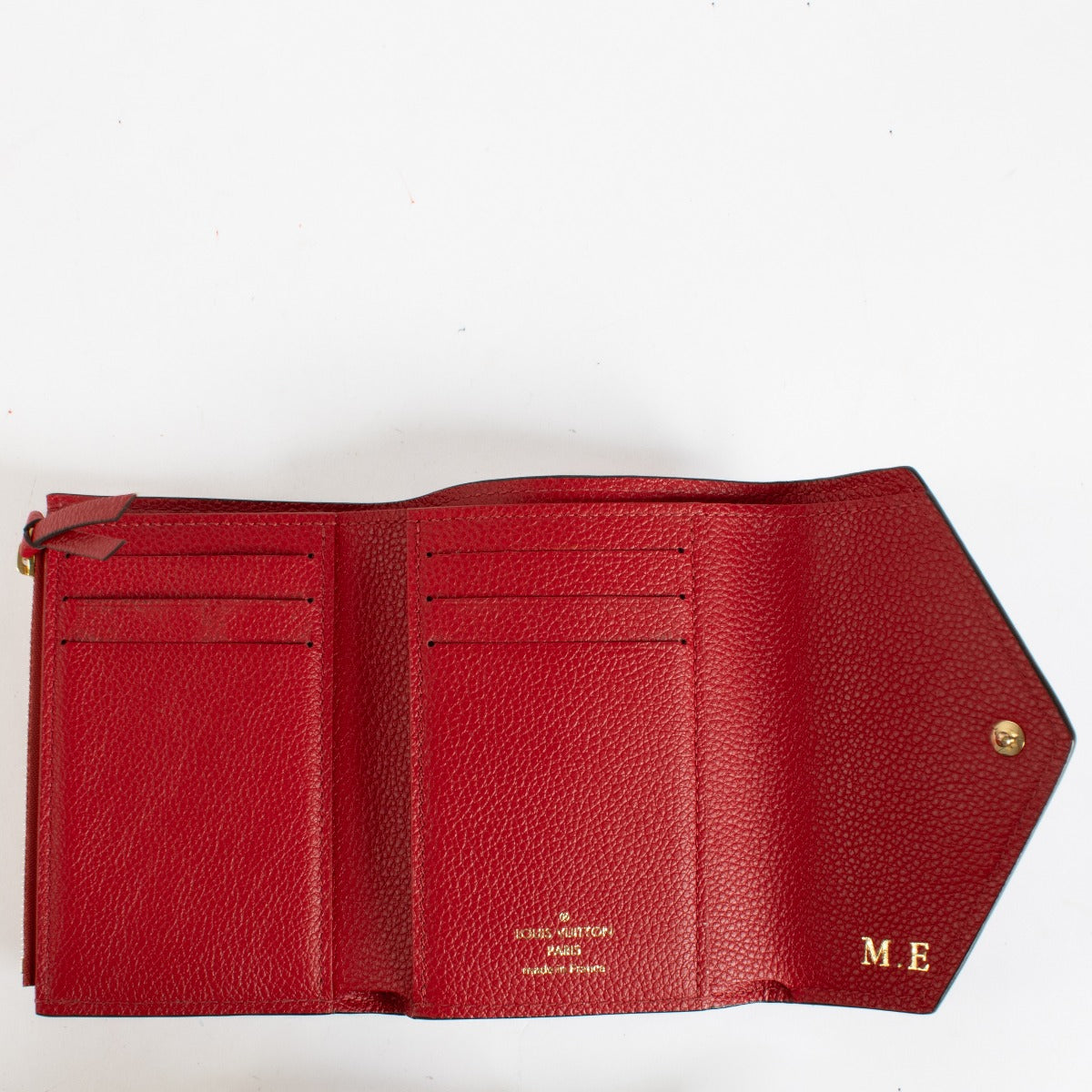 Authentic pre-loved Louis Vuitton Red Monogram Empreinte Victorine Wallet on Labellov.com