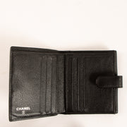 Shop this authentic Chanel Black Camelia Wallet pre-loved on Labellov.com