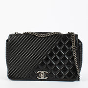 Shop the authentic Chanel Coco Boy Medium Quilted Glazed Calfskin Flap Bag in Noir with ruthenium hardware at Labellov.com.