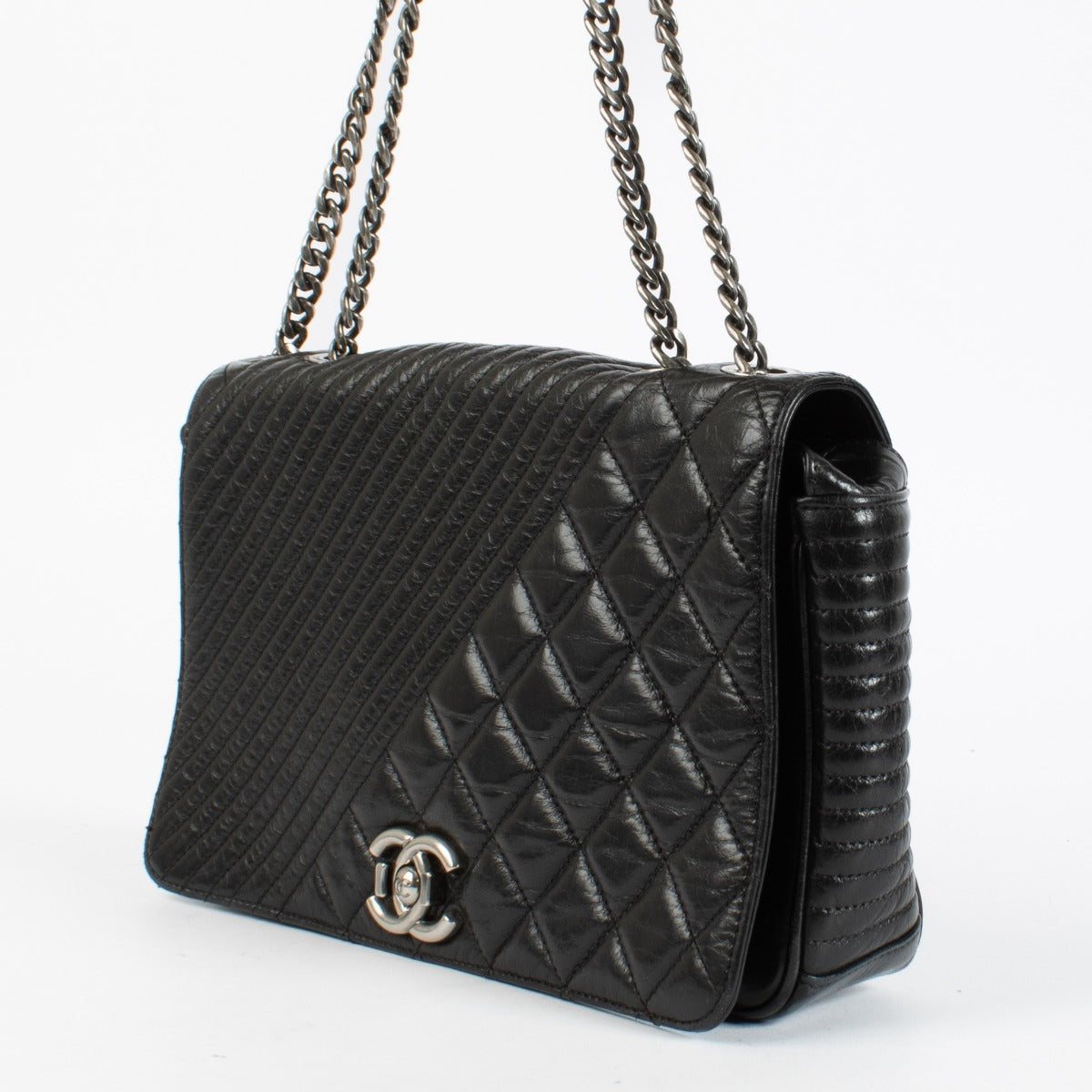 Shop the authentic Chanel Coco Boy Medium Quilted Glazed Calfskin Flap Bag in Noir with ruthenium hardware at Labellov.com.