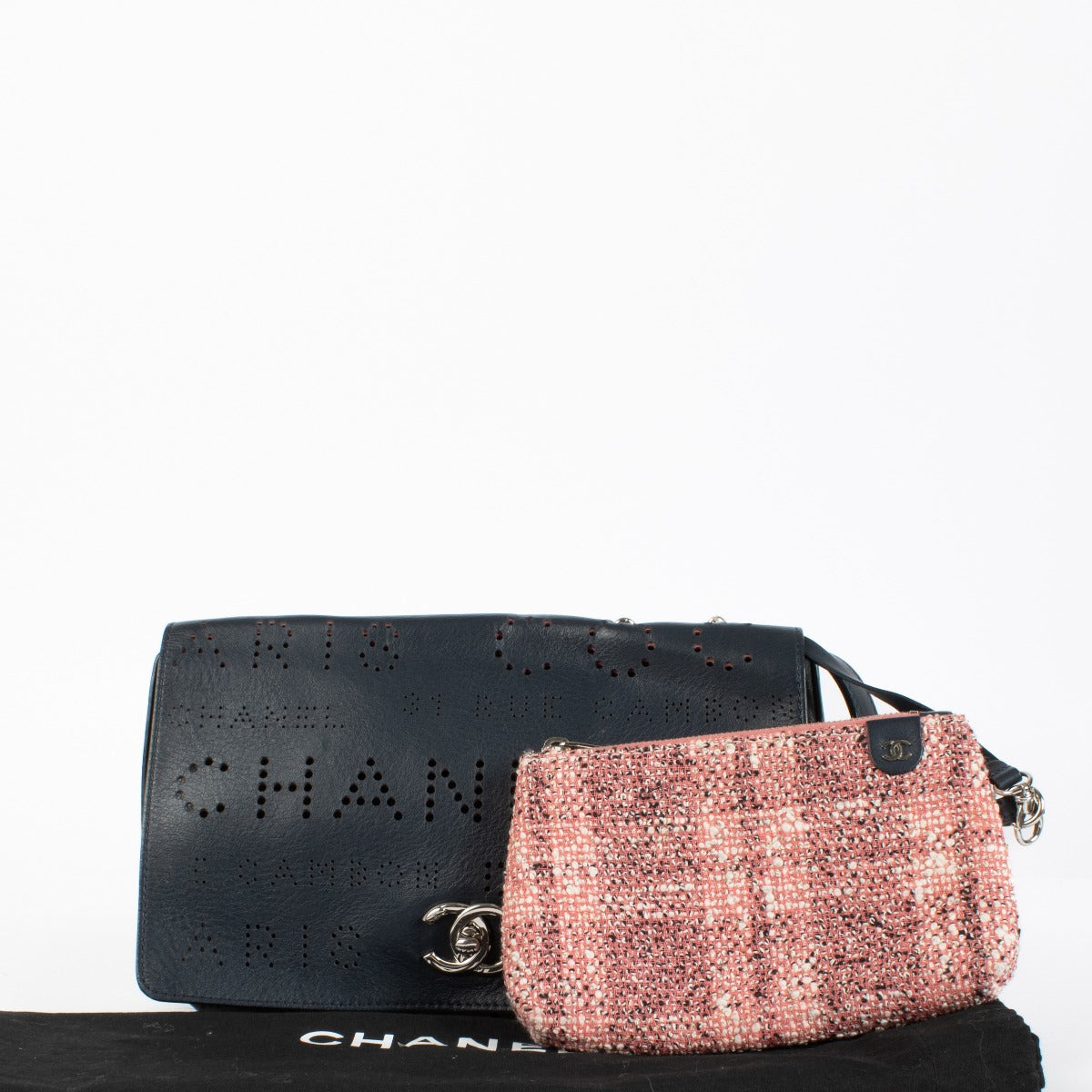 Chanel Blue Eyelet Flap Bag with silver chain strap and pink suede interior at Labellov.com