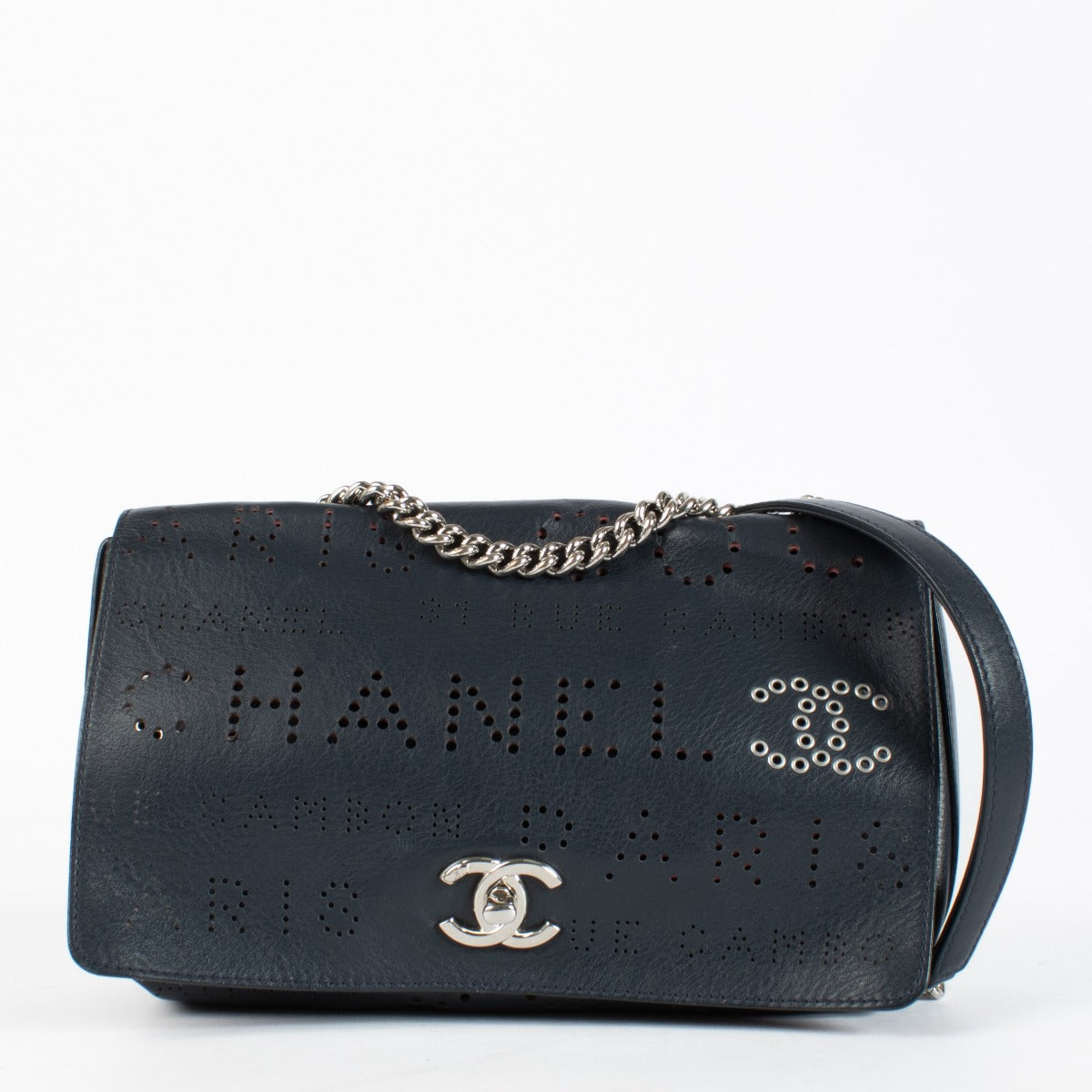 Chanel Blue Eyelet Flap Bag with silver chain strap and pink suede interior at Labellov.com