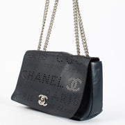 Chanel Blue Eyelet Flap Bag with silver chain strap and pink suede interior at Labellov.com