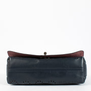 Chanel Blue Eyelet Flap Bag with silver chain strap and pink suede interior at Labellov.com