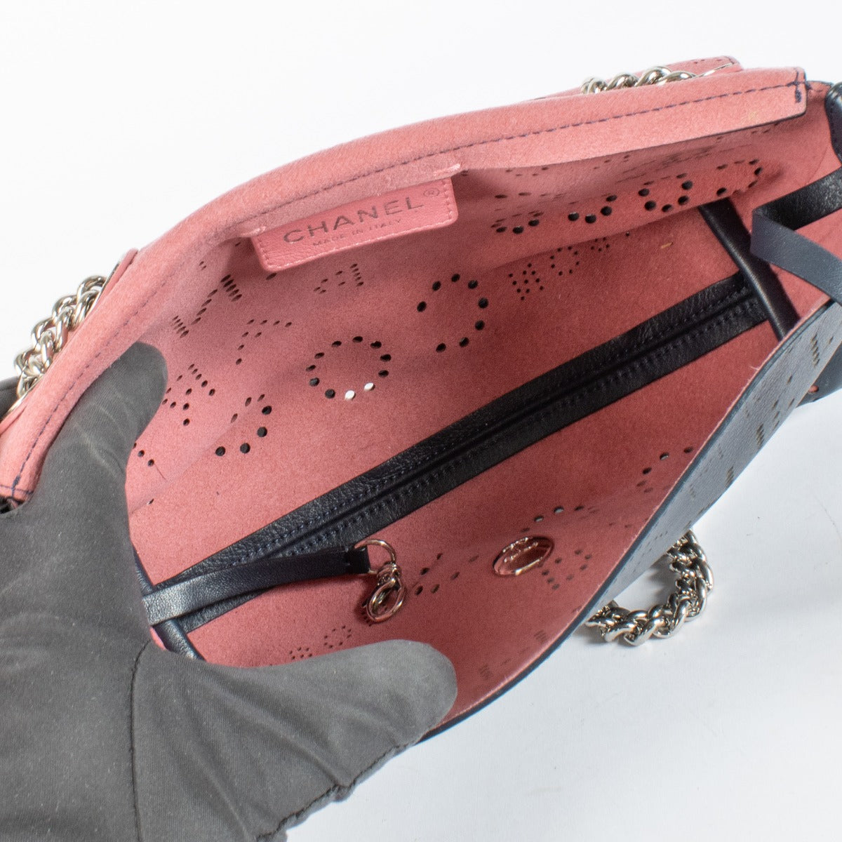 Chanel Blue Eyelet Flap Bag with silver chain strap and pink suede interior at Labellov.com