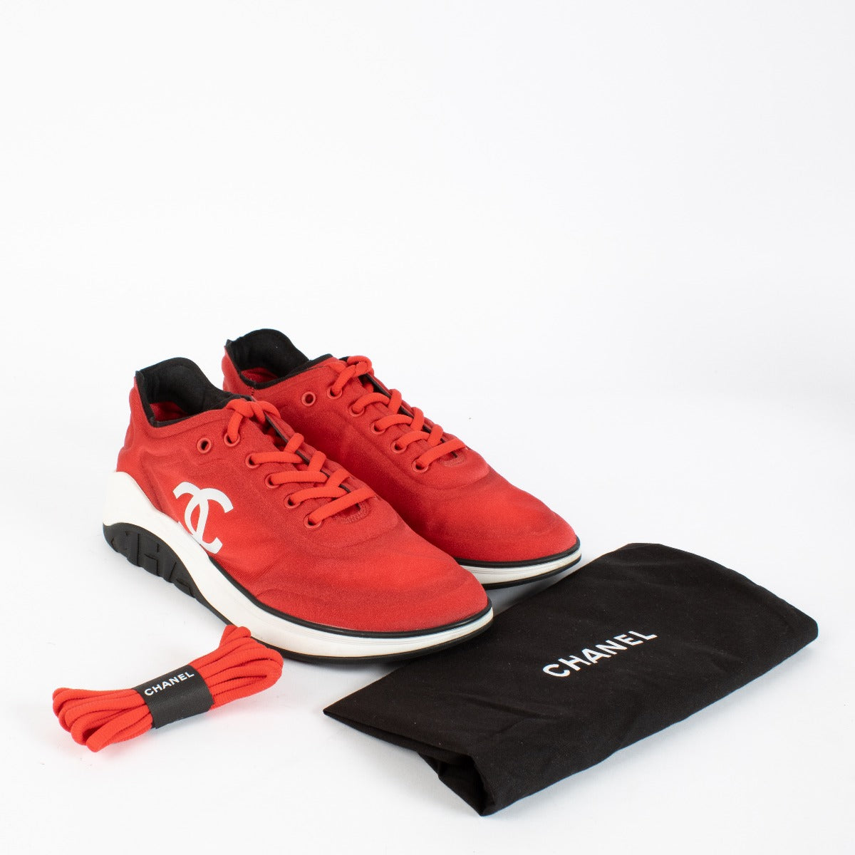 Authentic pre-loved Chanel Red Ankle Strap Cloth Sneakers — Size 39.5 on Labellov.com