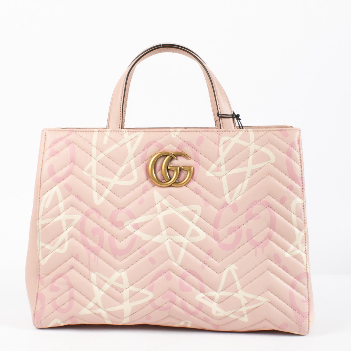 Shop the authentic Gucci GG Marmont Graffiti Matelassé Tote in pink leather at Labellov.com.