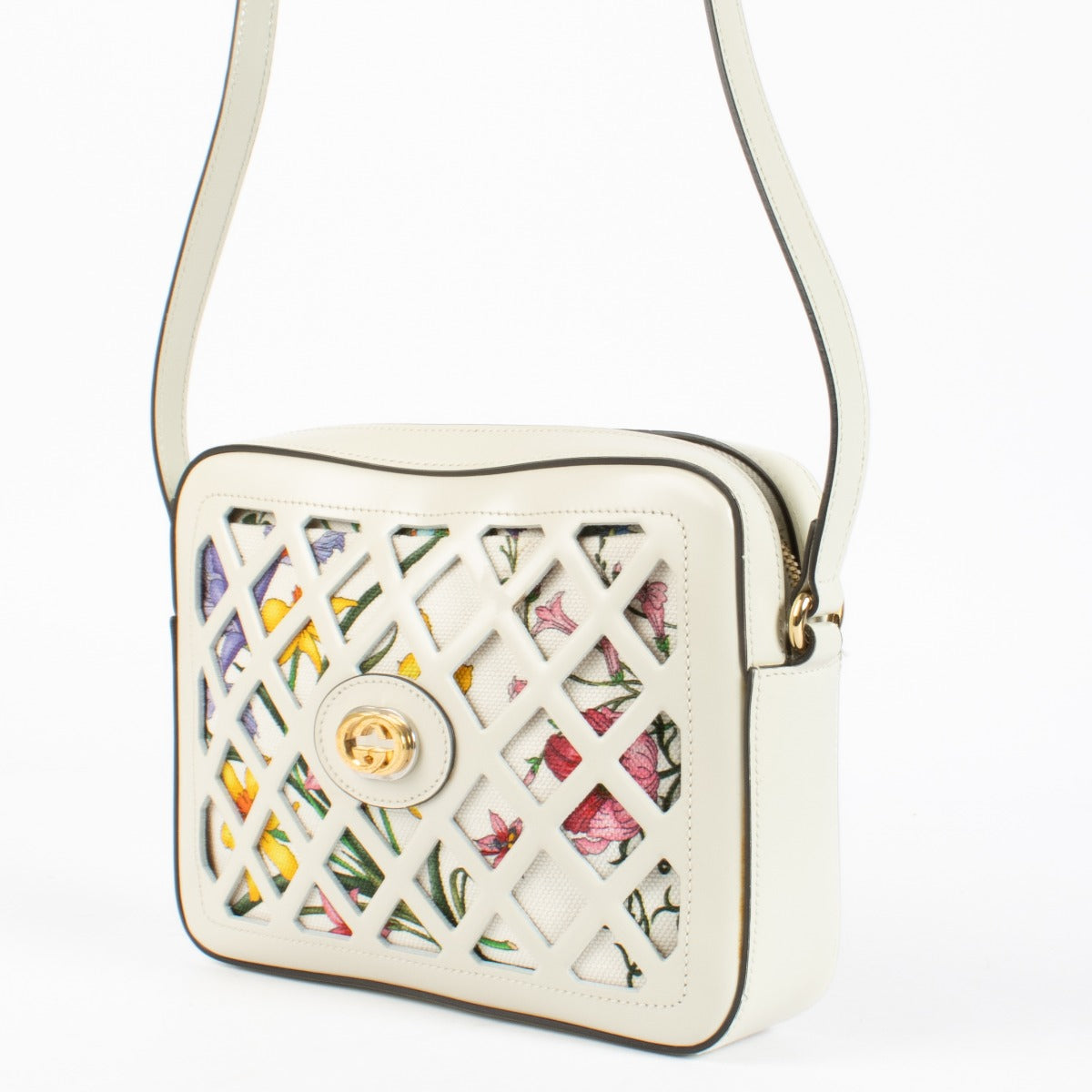Authentic preloved Gucci White Cutout Leather Floral Canvas Bag on Labellov.com