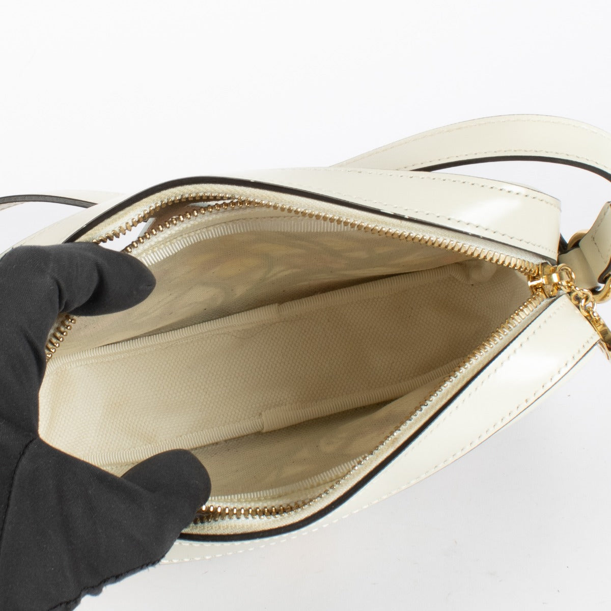 Authentic preloved Gucci White Cutout Leather Floral Canvas Bag on Labellov.com