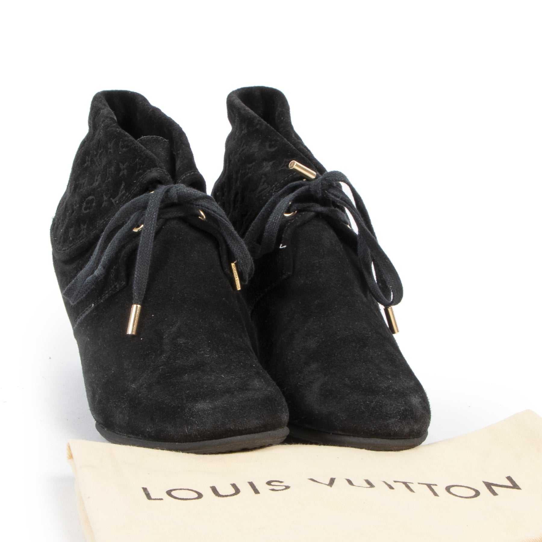 We buy and sell your authentic desginer Louis Vuitton Black Suede Wedge Booties