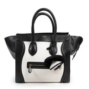 Céline Black and White Fur Bag Charm. Authentieke Céliné accessoires bij LabelLOV Antwerpen. Authentique luxury en ligne webshop LabelLOV. Authentic Céline accessories at LabelLOV Antwerp.