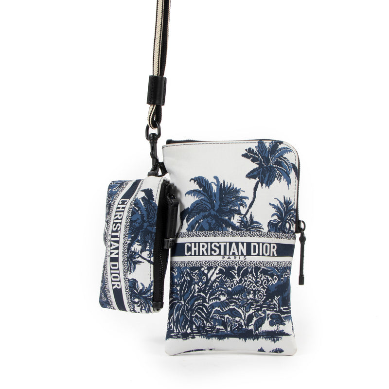 Christian Dior Multifunctional Embroidered Palm Tree Toile Pouch for the best price at Labellov secondhand luxury in Antwerp. We buy and sell your bags online at Labellov.