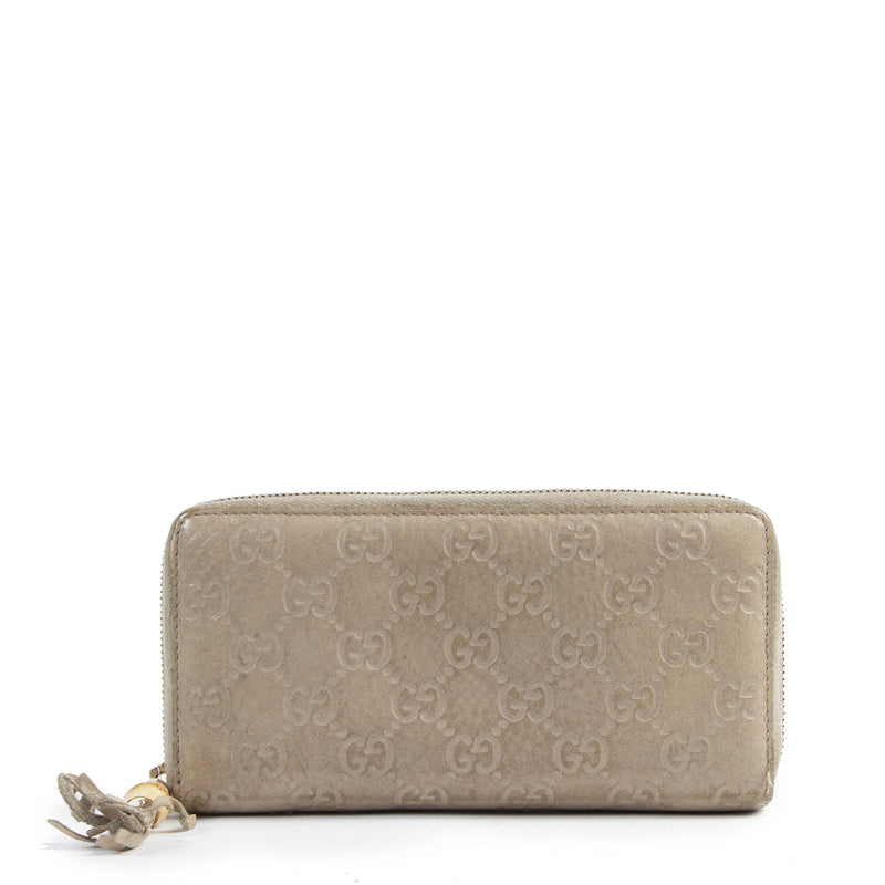 Gucci Monogram Embossed Zipper Wallet available online for the best price at Labellov