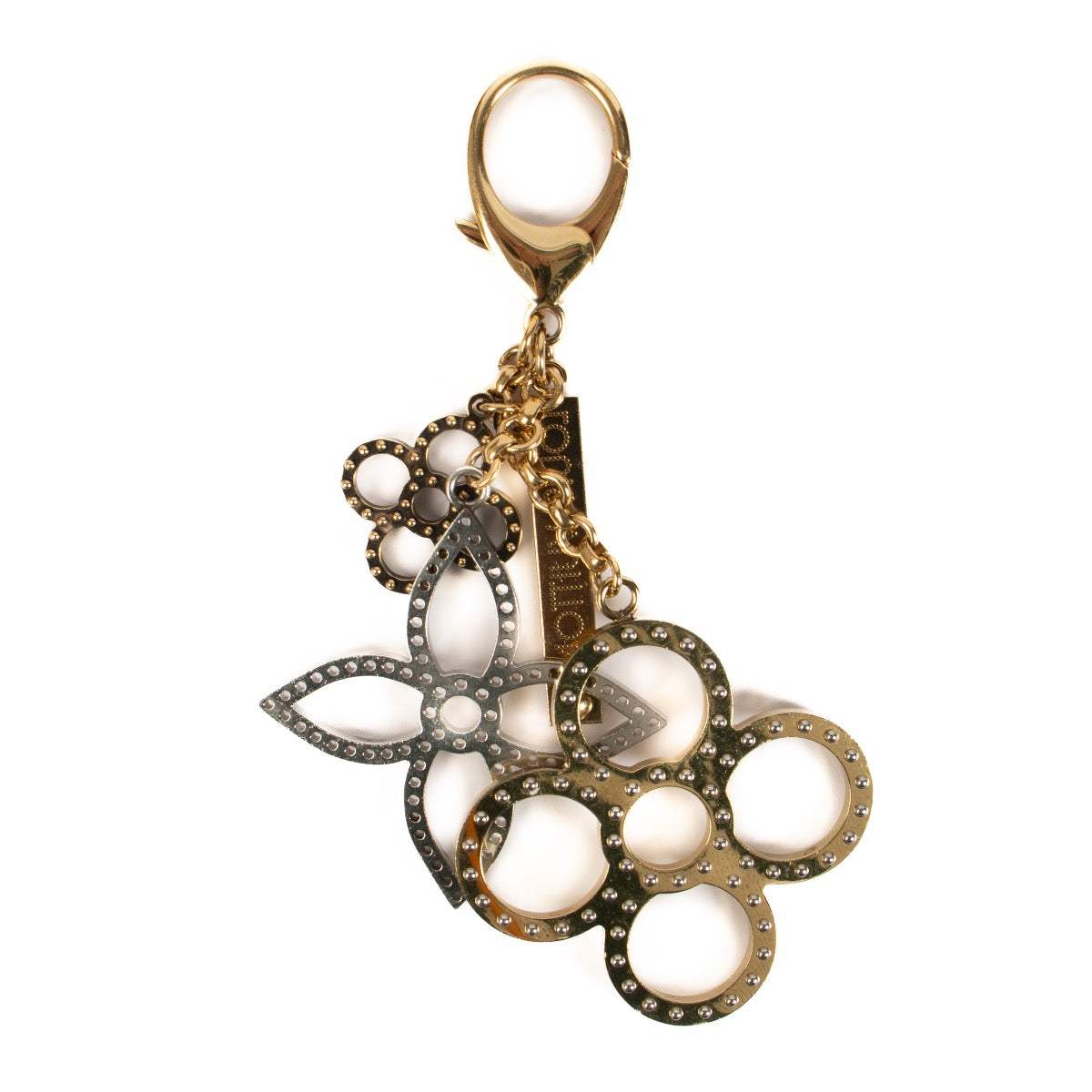 Shop safe online at Labellov in Antwerp, Brussels and Knokke this 100% authentic second hand Louis Vuitton Gold Monogram Tapage Key Chain