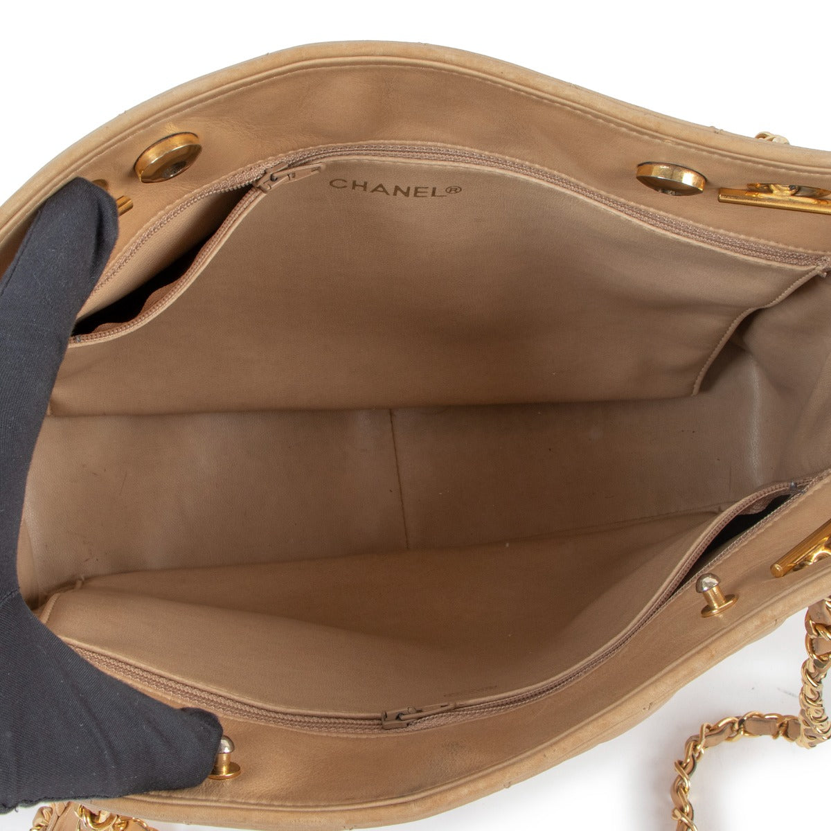 Buy online authentic second hand Chanel Beige Quilted Lambskin CC Charm Tote bag in very good condition at Labellov in Antwerp