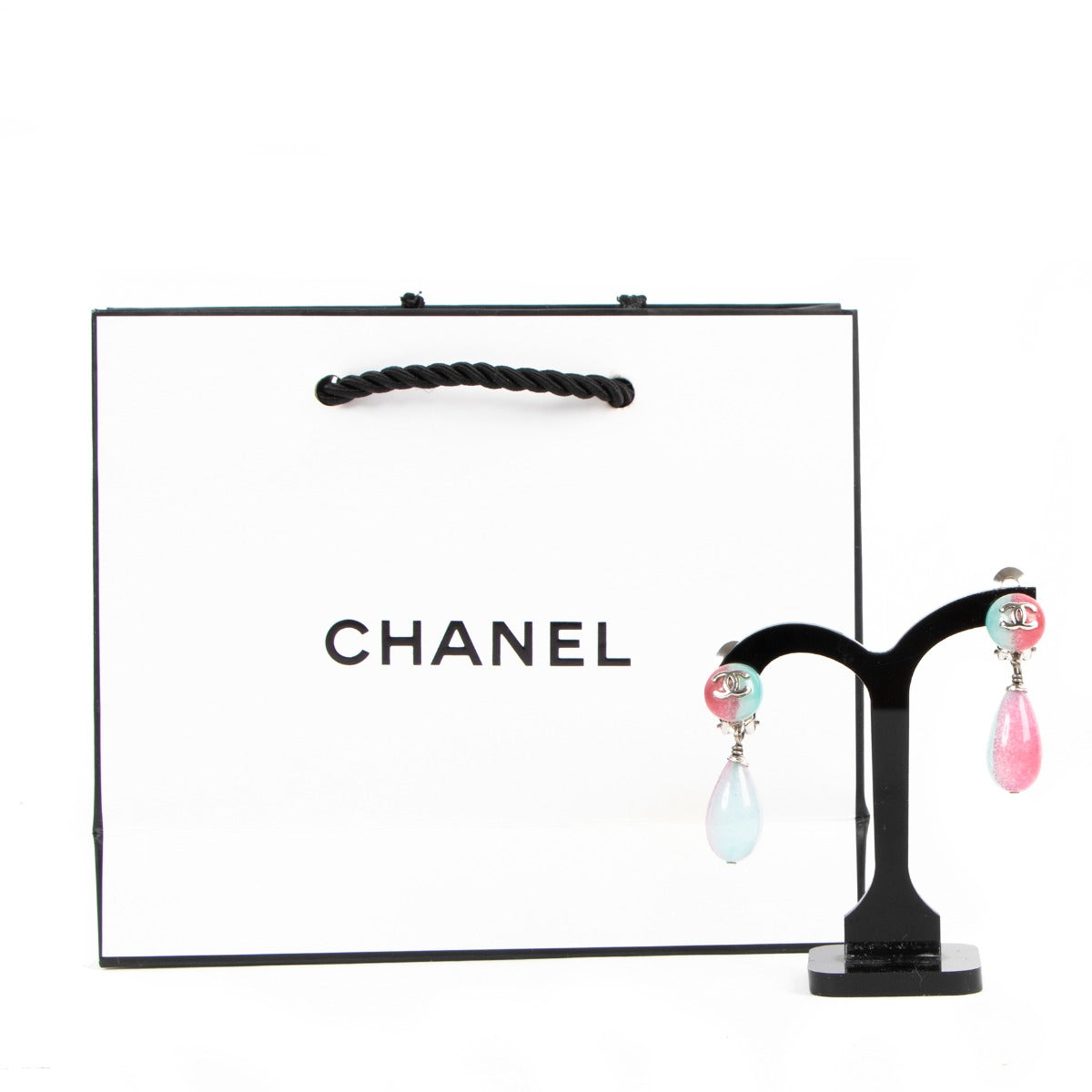 Buy online authentic second hand Chanel pink/blue CC clip-on earrings in very good condition at Labellov in Antwerp.