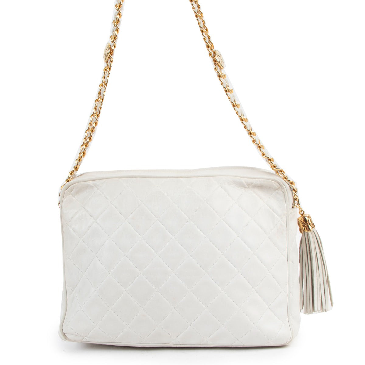 Buy online authentic second hand Chanel Vintage White Quilted Lambskin CC Tassel Camera Bag in very good condition at Labellov in Antwerp