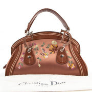 Buy online an authentic second hand Christian Dior 2005 Limited Edition Brown Satin Floral embroidered Detective Satchel Bag in very good condition at Labellov in Antwerp.