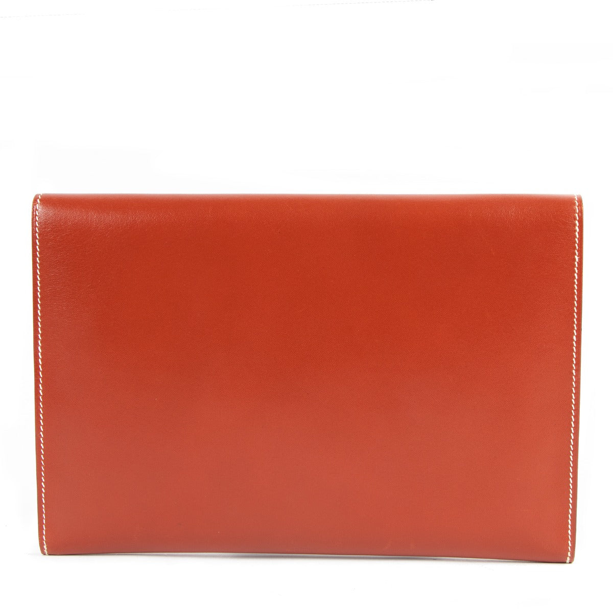 Buy online an authentic second hand Hermès Orange Leather Rio Clutch in very good condition at Labellov in Antwerp.