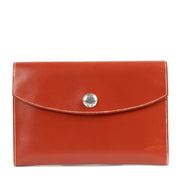 Buy online an authentic second hand Hermès Orange Leather Rio Clutch in very good condition at Labellov in Antwerp.