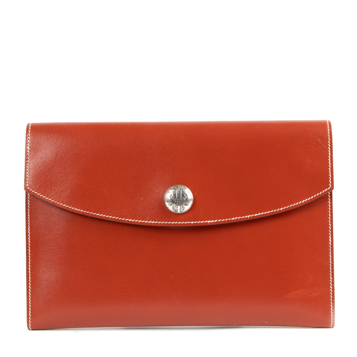 Buy online an authentic second hand Hermès Orange Leather Rio Clutch in very good condition at Labellov in Antwerp.