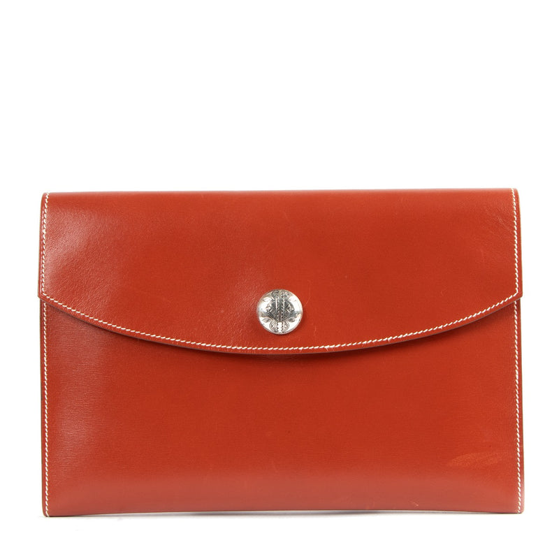 Buy online an authentic second hand Hermès Orange Leather Rio Clutch in very good condition at Labellov in Antwerp.