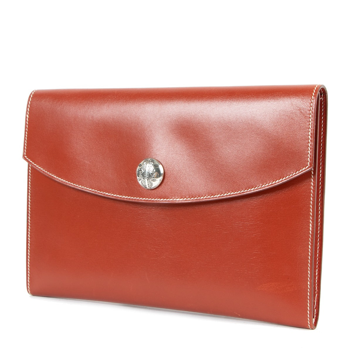 Buy online an authentic second hand Hermès Orange Leather Rio Clutch in very good condition at Labellov in Antwerp.