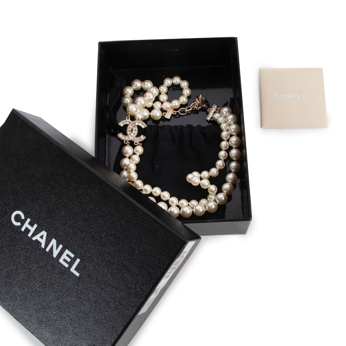 Buy an authentic second hand Chanel Faux Pearl Necklace with Interlocking CC Logo in very good condition at Labellov