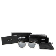 Buy online authentic second hand white polarized Aviator Chanel 4204-Q sun glasses in very good condition at Labellov in Antwerp.