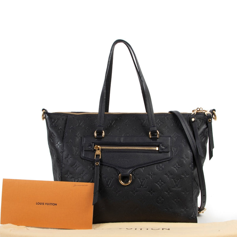 Get this Louis Vuitton Blue Lumineuse PM Monogram Empreinte Infini at Labellov online or in store in very good condition with no immediate sifn of use.