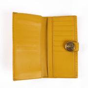 Shop this authentic Gucci Yellow Guccissima Crest Wallet pre-loved on Labellov.com