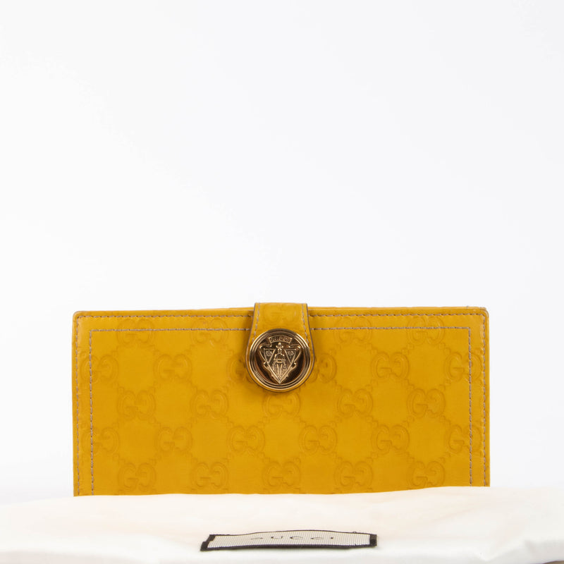 Shop this authentic Gucci Yellow Guccissima Crest Wallet pre-loved on Labellov.com
