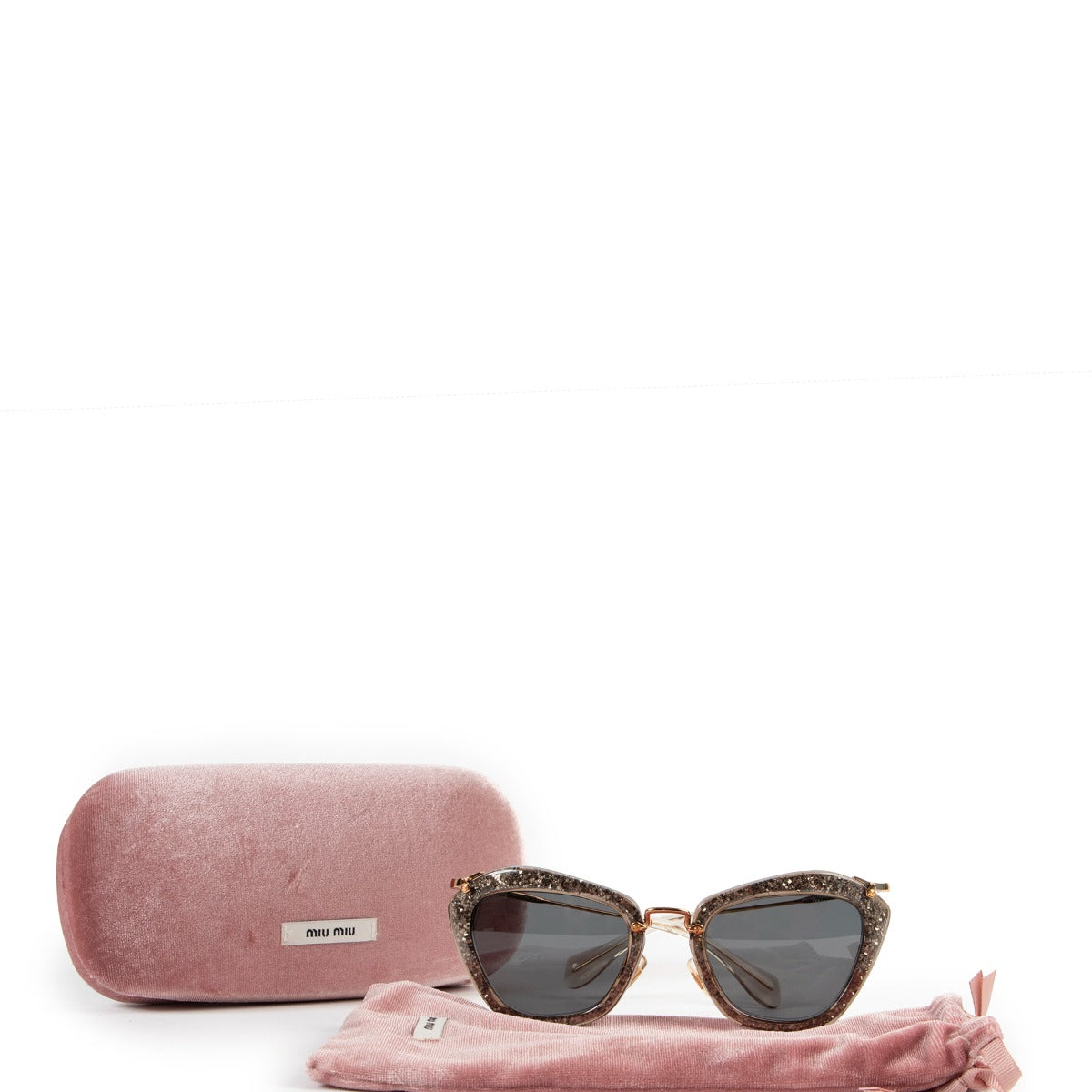 Miu Miu Noir with Golden Glitter Sunglasses Buy this unique piece here safely!