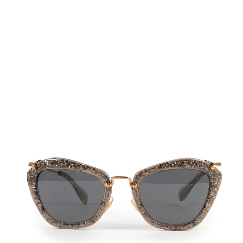 Miu Miu Noir with Golden Glitter Sunglasses Buy this unique piece here safely!