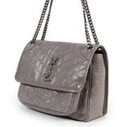 Achetez en ligne en toute sécurité ce sac gris Saint Laurent Niki Medium.
