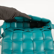 Shop the authentic Bottega Veneta Turquoise Lambskin Padded Cassette Bag on Labellov.com.