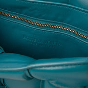 Shop the authentic Bottega Veneta Turquoise Lambskin Padded Cassette Bag on Labellov.com.