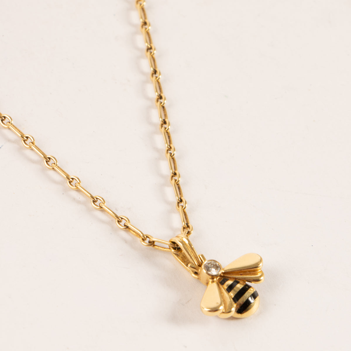Shop this authentic Cartier Diamond Yellow Gold Bee Pendant Necklace pre-loved on Labellov.com