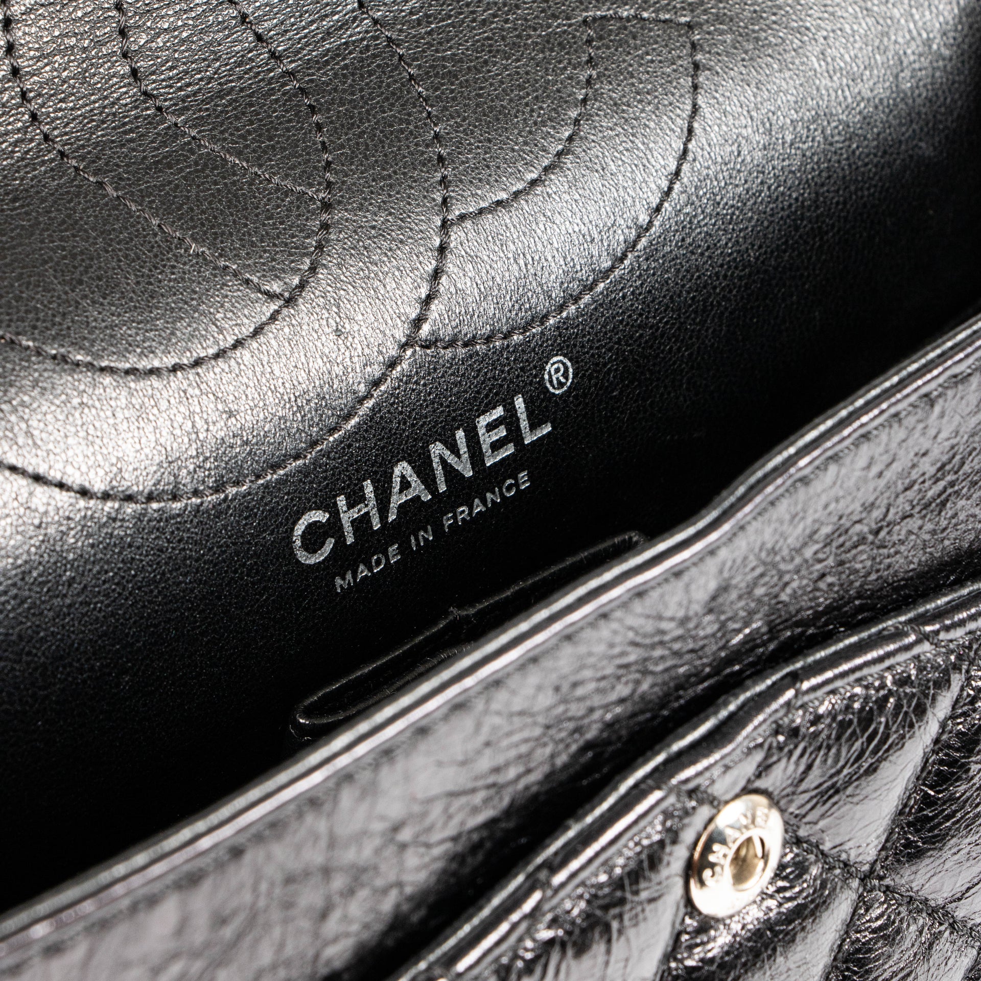 Shop this authentic Chanel Black Aged Calfskin Medium 2.55 Reissue Bag with Micro Pouch pre-loved on Labellov.com 