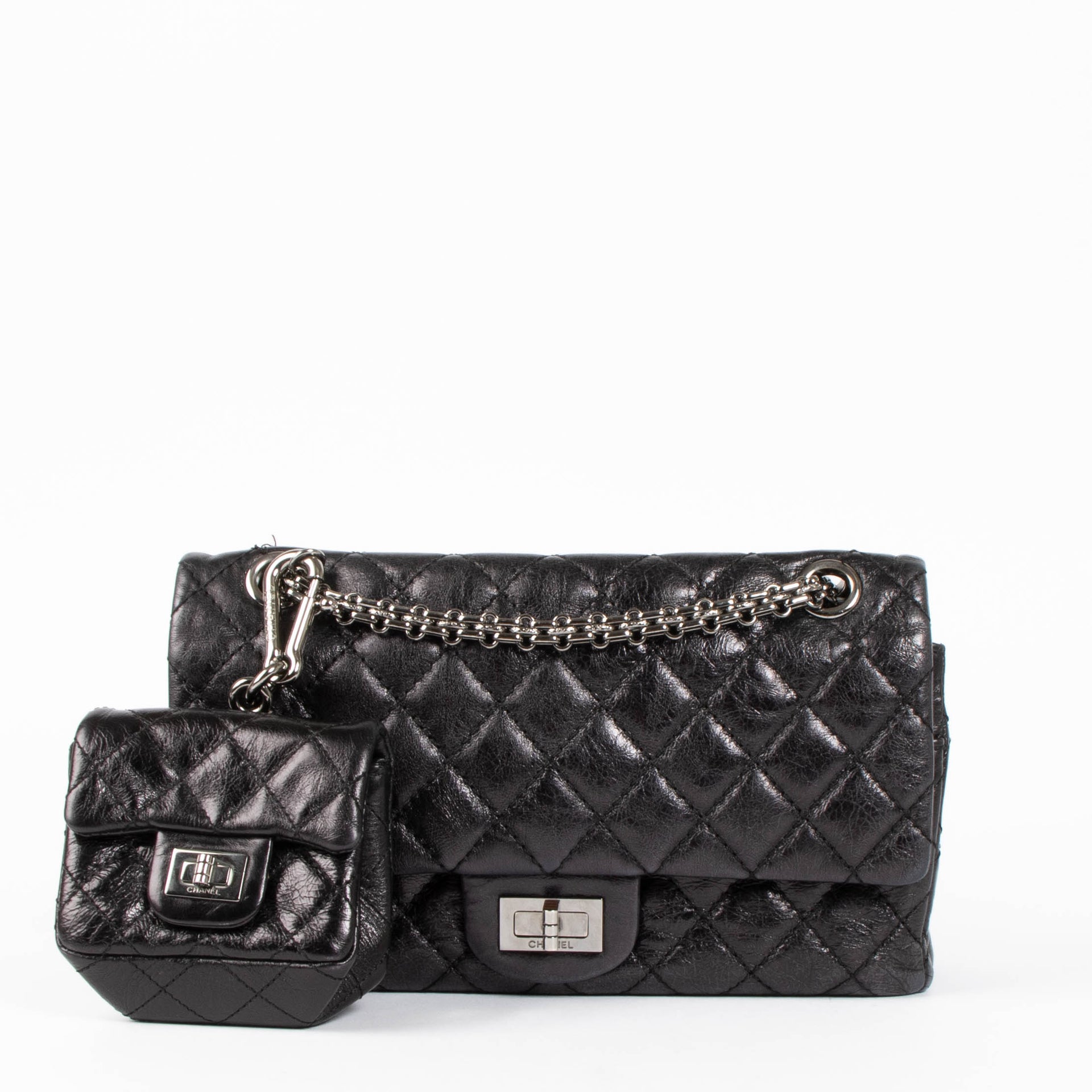 Shop this authentic Chanel Black Aged Calfskin Medium 2.55 Reissue Bag with Micro Pouch pre-loved on Labellov.com 