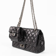 Shop this authentic Chanel Black Aged Calfskin Medium 2.55 Reissue Bag with Micro Pouch pre-loved on Labellov.com 